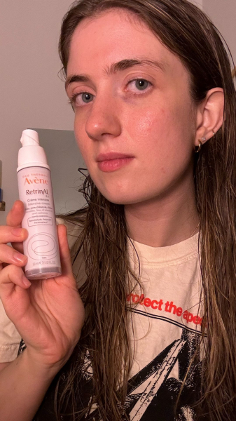 A selfie of contributing commerce editor Annie Blackman holding the Avène RetrinAL 0.1 Intensive Cream